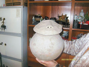 新石器时代人面纹红陶罐