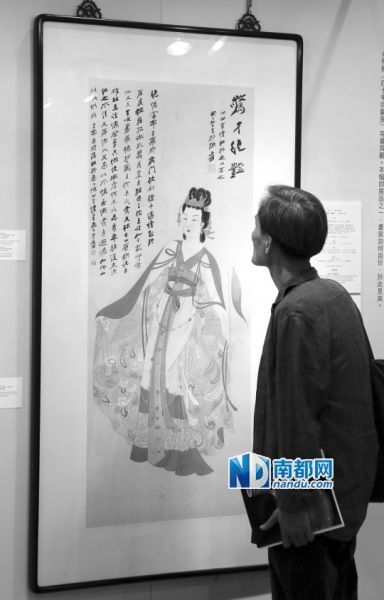 观众在香港苏富比2014年秋拍预展上观看张大千1953年作品《惊才绝艳》。2014年10月，该作品以6620万港元高价成交，为2001年上拍成交价的14倍。 新华社发