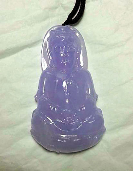 白纸底、日光灯下的同一块佛像