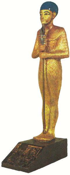 图坦卡蒙墓里殉葬的一尊神像，是在乌木的外部贴满了真金箔制成，头发上镶嵌着青金石。