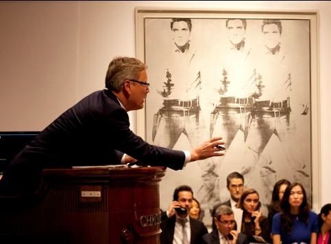 安迪‧沃荷《猫王三重影》11月现场拍卖场景