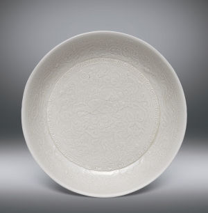 北宋 定窑白瓷印花螭龙纹狮子戏球洗 230万港币 中国嘉德香港秋拍