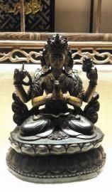 清紫檀四臂观音。 图片由受访者提供